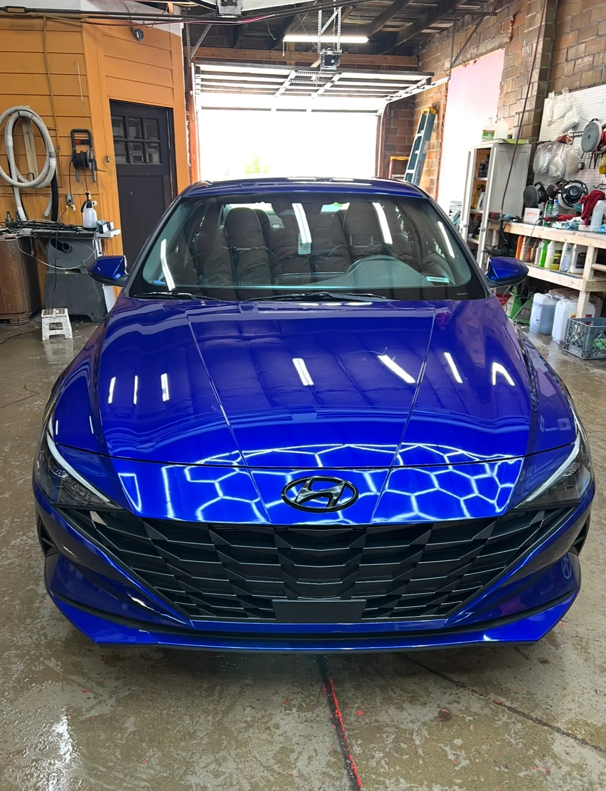 Front view of polished blue Hyundai sedan