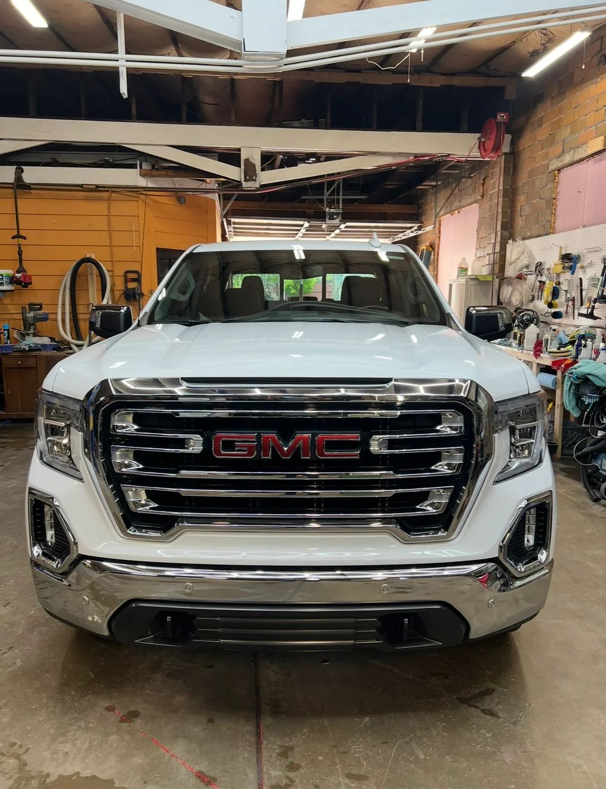 Front view of polished white GMC truck